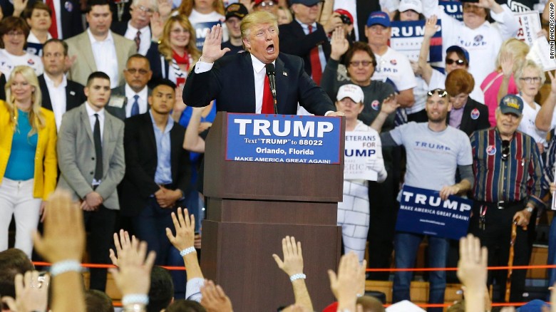 Republican presidential candidate Donald Trump asks the crowd to take a pledge to promise to vote for him during a campaign rally on Saturday, March 5, in Orlando, Florida.