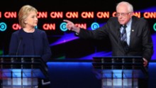 FLINT, MI - MARCH 06:  /Democratic presidential candidate Senator Bernie Sanders (D-VT) speaks as Democratic presidential candidate Hillary Clinton looks on during the CNN Democratic Presidential Primary Debate at the Whiting Auditorium at the Cultural Center Campus on March 6, 2016 in Flint, Michigan. Voters in Michigan will go to the polls March 8 for the state&#39;s primary.  (Photo by Scott Olson/Getty Images)