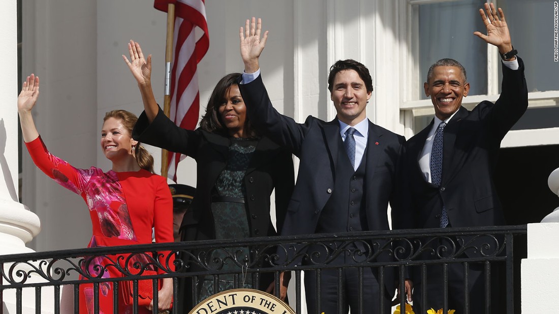 The two couples wave from the White House balcony on March 10.