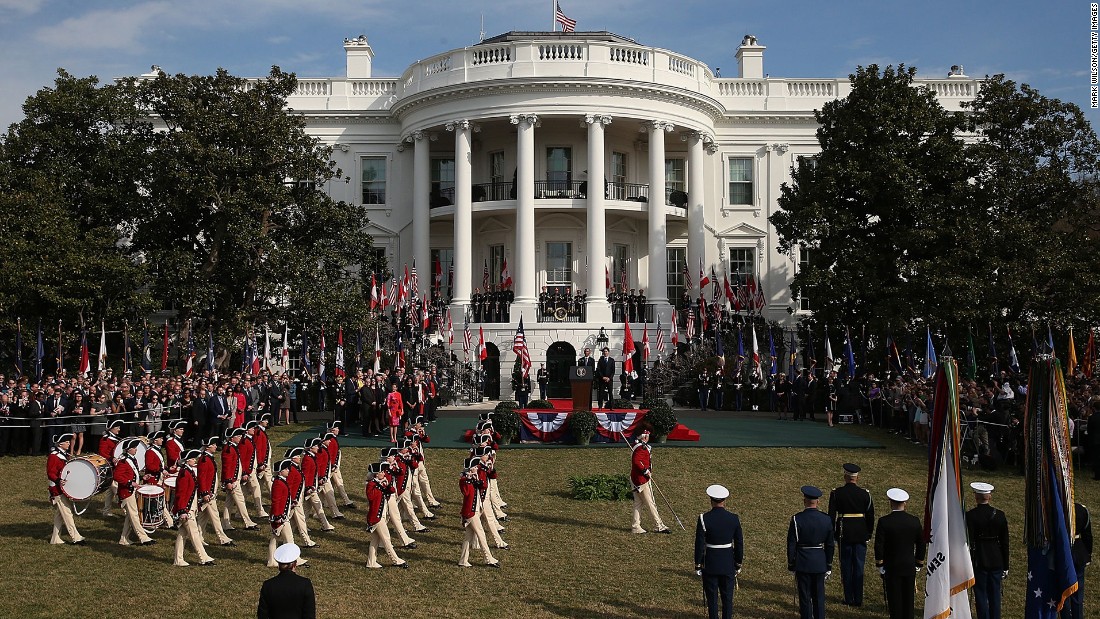 A fife and drum corps performs during the arrival ceremony on the South Lawn.