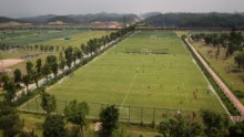 The 167-acre site has 50 pitches and is home to 2,600 boys and 200 girls who, it is hoped, will star for China in the future.