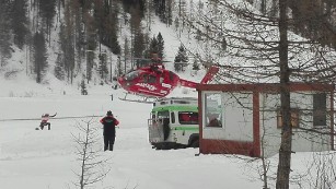 A rescue helicopter takes off in Valle Aurina in the Italian Alps to try to reach Monto Nevoso where at least six skiers have died in an avalanche Saturday, March 12, 2016. 