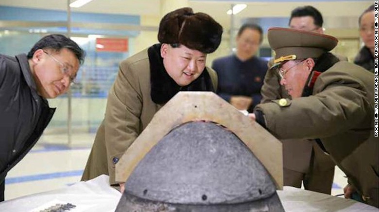 North Korean leader Kim Jung-un reviewing a ballistic rocket simulation.