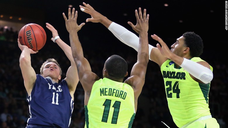 Makai Mason, left, of the Yale Bulldogs shoots as he is defended by Lester Medford, center,  and Ishmail Wainright of the Baylor Bears. Mason led Yale with 31 points.