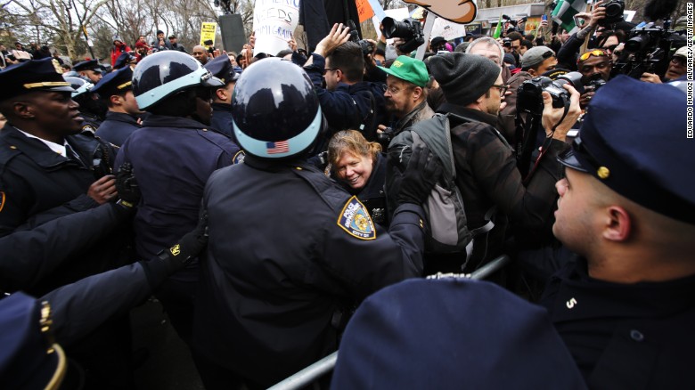 Protesters clash with NYPD officers while they take part in a protest against Republican presidential candidate Donald Trump on March 19, 2016 in New York City.