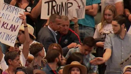 Trump Rally Attendee Kicks Man; Campaign Manager Appears To Grab At Protester