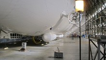 Pumped full of helium, Airlander 10 demonstrates its buoyancy within the hangar. It faces several weeks of ground tests before it'll be allowed out to fly.