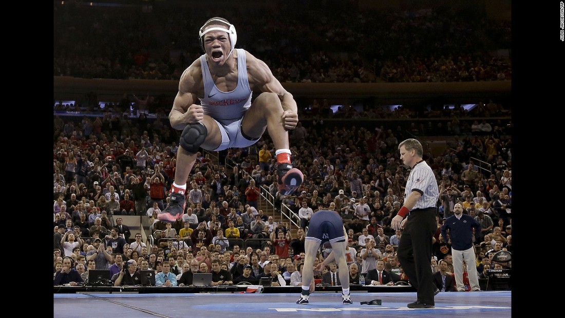 Ohio State wrestler Myles Martin jumps after defeating Penn State&#39;s Bo Nickal for the NCAA&#39;s 174-pound title on Saturday, March 19.