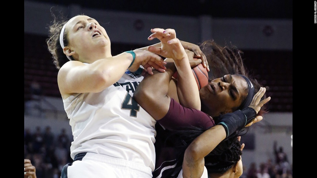Michigan State&#39;s Jasmine Hines, left, battles Mississippi State&#39;s Chinwe Okorie for a ball during an NCAA Tournament game in Starkville, Mississippi, on Sunday, March 20. The home team advanced with a 74-72 victory.