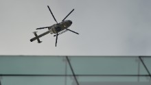 A police helicopter flies above the area near the Maalbeek metro station.