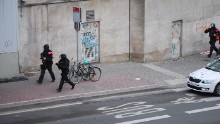 Police officers guard the area around the Maalbeek metro station.