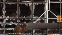 The blown-out windows of the airport are seen after the deadly attacks.