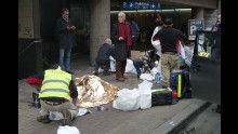 Wounded people are treated outside the Maalbeek metro station.