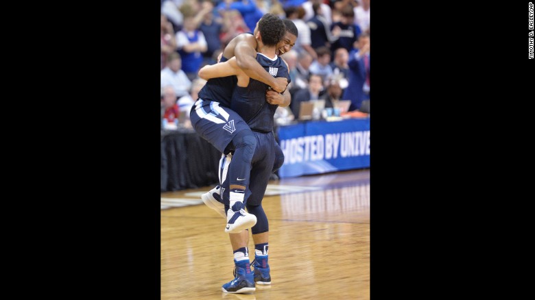 Villanova forward Kris Jenkins celebrates with teammate Josh Hart after defeating Kansas in the South Regional Final of the NCAA tournament on Saturday.