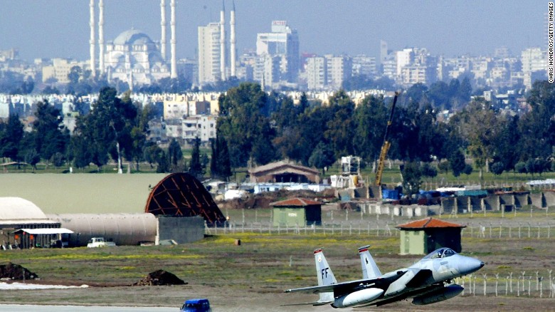 An F-15 fighter jet glides in for a landing in front of Adana&#39;s main mosque March 7, 2003 at Incirlik Air Force Base in Turkey.