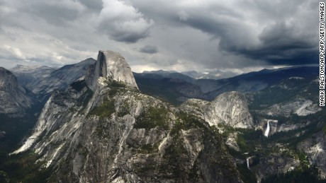 Vew of the Half Dome monolith from Glacier Point at the Yosemite National Park in California on June 4, 2015.  At first glance the spectacular beauty of the park with its soaring cliffs and picture-postcard valley floor remains unblemished, still enchanting the millions of tourists who flock the landmark every year. But on closer inspection, the drought&#39;s effects are clearly visible.                AFP PHOTO/MARK RALSTON        (Photo credit should read MARK RALSTON/AFP/Getty Images)