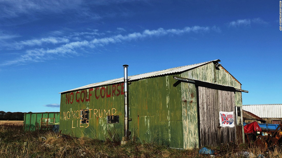 Here, Scottish folk touched by Trump&amp;#39;s economic investment in their community, leave messages of thanks daubed on shed.