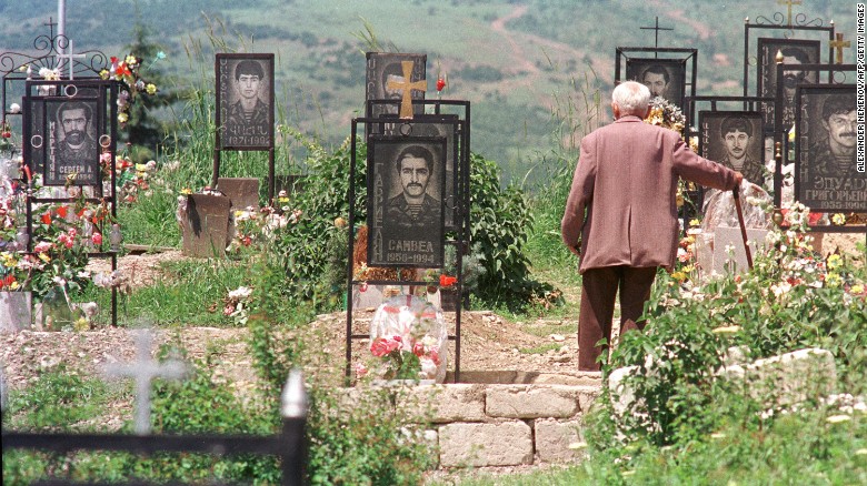 An Armenian man visits his son&#39;s grave at a memorial cemetery in Stepanakert, Azerbaijan, the capital of Nagorno Karabakh, in June 1994. 
