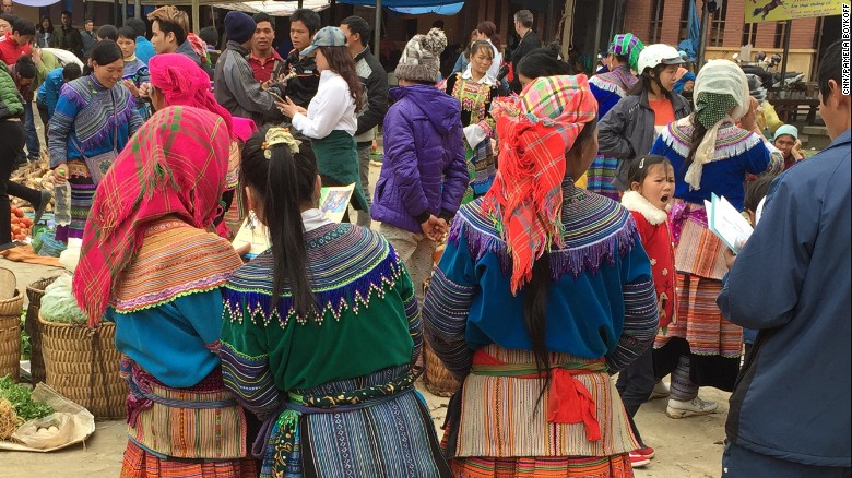 Vietnamese girls as young as 13 are taken to China by human traffickers, to be sold as brides. Pictured, girls reading leaflets designed to educate them about the threat of sex trafficking at a market in Northern Vietnam. &lt;br /&gt;