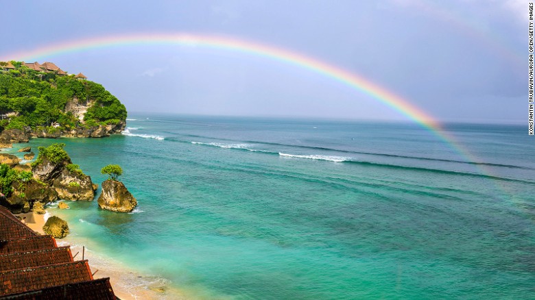 White limestone cliffs are a dramatic contrast to the blue waters at this small surfing beach on Bali&#39;s Bukit Peninsula. Visitors can stay in everything from surfing camps to boutique resorts and private villas. 