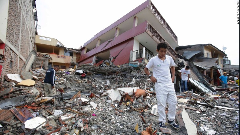 People search through the rubble of destroyed homes in Pedernales on April 17.