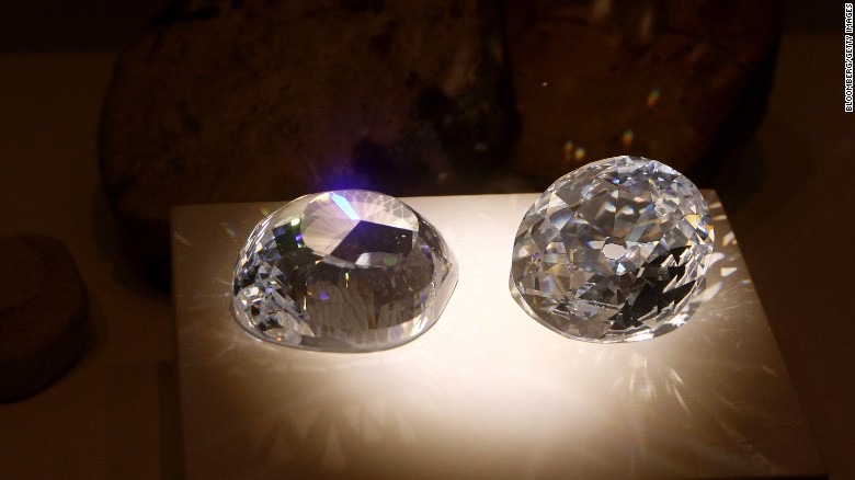 Cubic zirconia replicas of the original and a modern cut of the Kohinoor diamond.