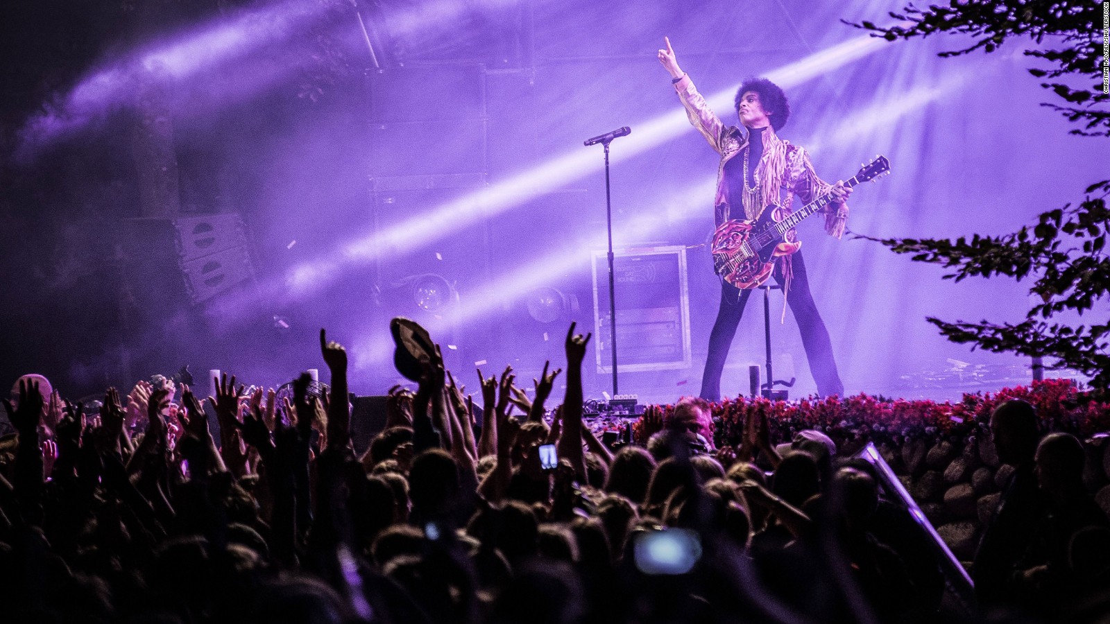 Mandatory Credit: Photo by Gonzales Photo/Christian Hjo/REX/Shutterstock (3609461a)
The American pop star Prince is pointing at the stars while performing his live show at the Danish music festival Skanderborg Festival 2013. Denmark 2013.
STOCK

