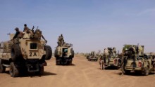 The region's soft sand is ideal for hiding improvised explosive devices, or IEDs. This means the military must travel in heavily armored convoys with mine-proof trucks providing protection from the front.