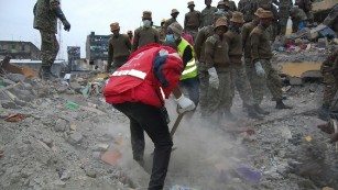 Kenyan rescue and recovery workers at the scene of a building collapse in Nairobi.