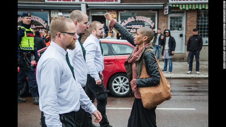 Tess Apslund, 42, stands with a raised fist in front of uniformed neo-Nazis during a Nordic Resistance Movement demonstration in Borlange, Sweden, on Sunday, May 1. Click through the gallery to see memorable images from other protests throughout history.