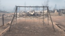The remains of a swing sits in a residential neighborhood destroyed by the fire on May 6, in Fort McMurray, Alberta.