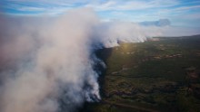 A huge plume of smoke from the wildfires rises over Fort McMurray in this aerial photograph taken in Alberta, Canada, on May 6.