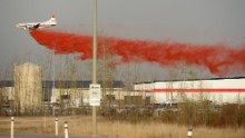 A plane drops fire retardant on a nearby wildfire in Fort McMurray, Alberta, on May 6.