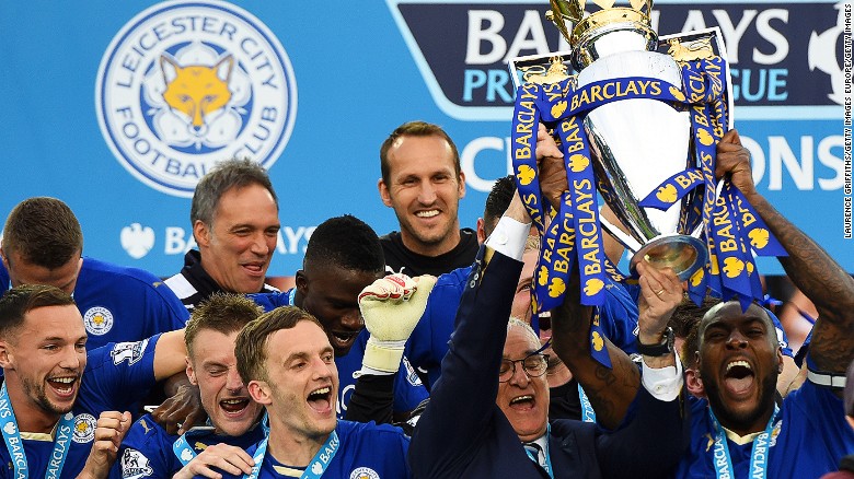 Captain Wes Morgan and manager Claudio Ranieri of Leicester City lift the Premier League trophy.