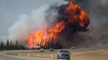 A ball of flame rises behind abandoned vehicles on  Highway 63 near Fort McMurray, Alberta, on Saturday, May 7. The fire has <a href="http://www.cnn.com/2016/05/07/americas/fort-mcmurray-fire-canada-duplicate-2/index.html" target="_blank">forced more than 88,000 people from their homes</a>.