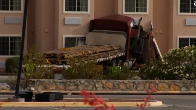 Police say the 18-wheeler left Interstate 10 in El Paso and crashed into a hotel, killing a man in his room 