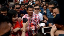 Presidential frontrunner and Davao City Mayor Rodrigo Duterte leaves the voting precint after casting his vote at Daniel Aguinaldo National High School in Davao City, on the southern island of Mindanao on May 9, 2016.