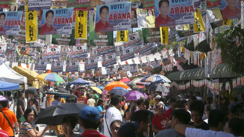 A street in suburban Manila, the capital of the Philippines, is covered in campaign posters. Polls opened nationwide on Monday, May 9, 2016. 