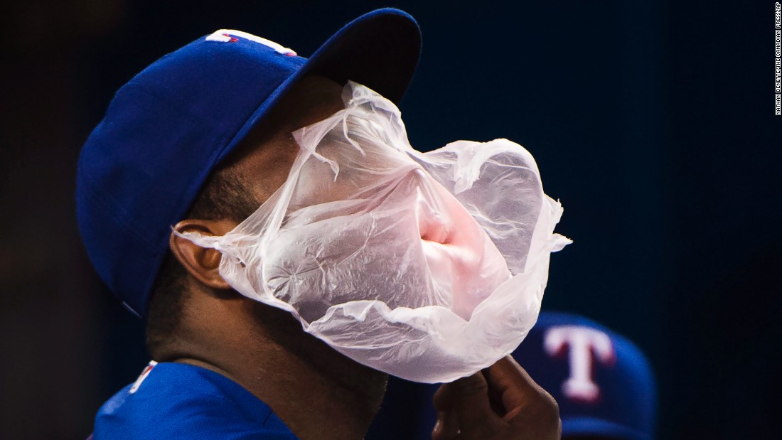 A giant bubble covers the face of Hanser Alberto as the Texas shortstop chews gum on Wednesday, May 4.