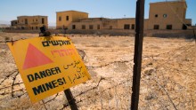 Seven churches sit where Christians believe Jesus Christ was baptized in the Jordan River, but they're surrounded by a barbed-wire fence and 5,000 landmines. The Ethiopian Orthodox church, seen here, is one of the largest at the site. By 2018, the fields around it might be mine-free.