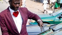 Abdulahi Olatoyan wears sharp suits while working as a car window washer in Abeokuta, southwest Nigeria. "I didn't want to be wandering around the streets doing nothing" he says.