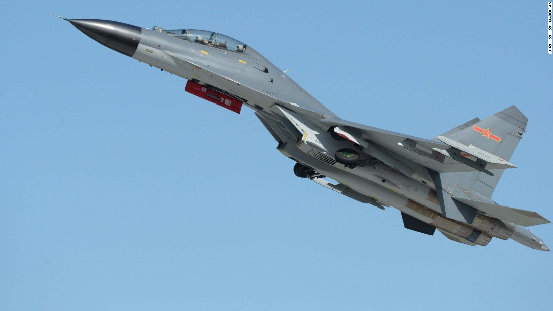 This picture taken on Septernber 12, 2015 shows the J-11B fighter aircraft from the People&#39;s Liberation Army (PLA) Air Force performing at the Dafangshen airport in Changchun, China&#39;s Jilin province during the bi-annual Changchun airshow. CHINA OUT AFP PHOTO (Photo credit should read STR/AFP/Getty Images)