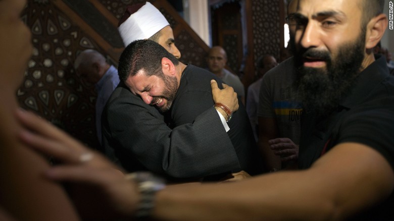 Samir Abdel Bary, the Imam of al Thawrah Mosque in Cairo, Egypt, gives condolences to film director Osman Abu Laban who lost four relatives on the crashed EgyptAir MS804 on Friday, May 20.