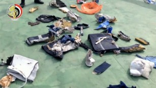 The debris includes passengers&#39; belongings from the plane.