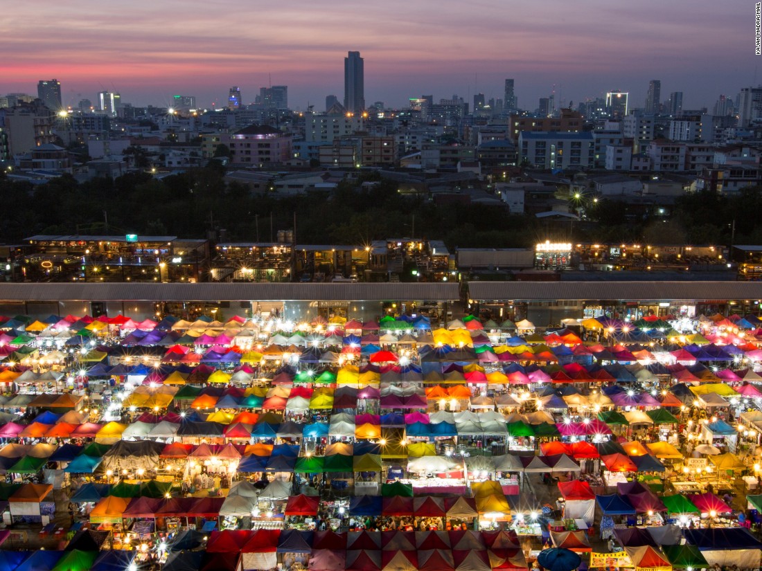 A rainbow of a different kind is created by the back-lit canopies of this colorful night market in Bangkok, taken by Kajan Madrasmail. (<a href="http://travel.nationalgeographic.com/photographer-of-the-year-2016/" target="_blank">Click here to enter NatGeo photo contest</a>)