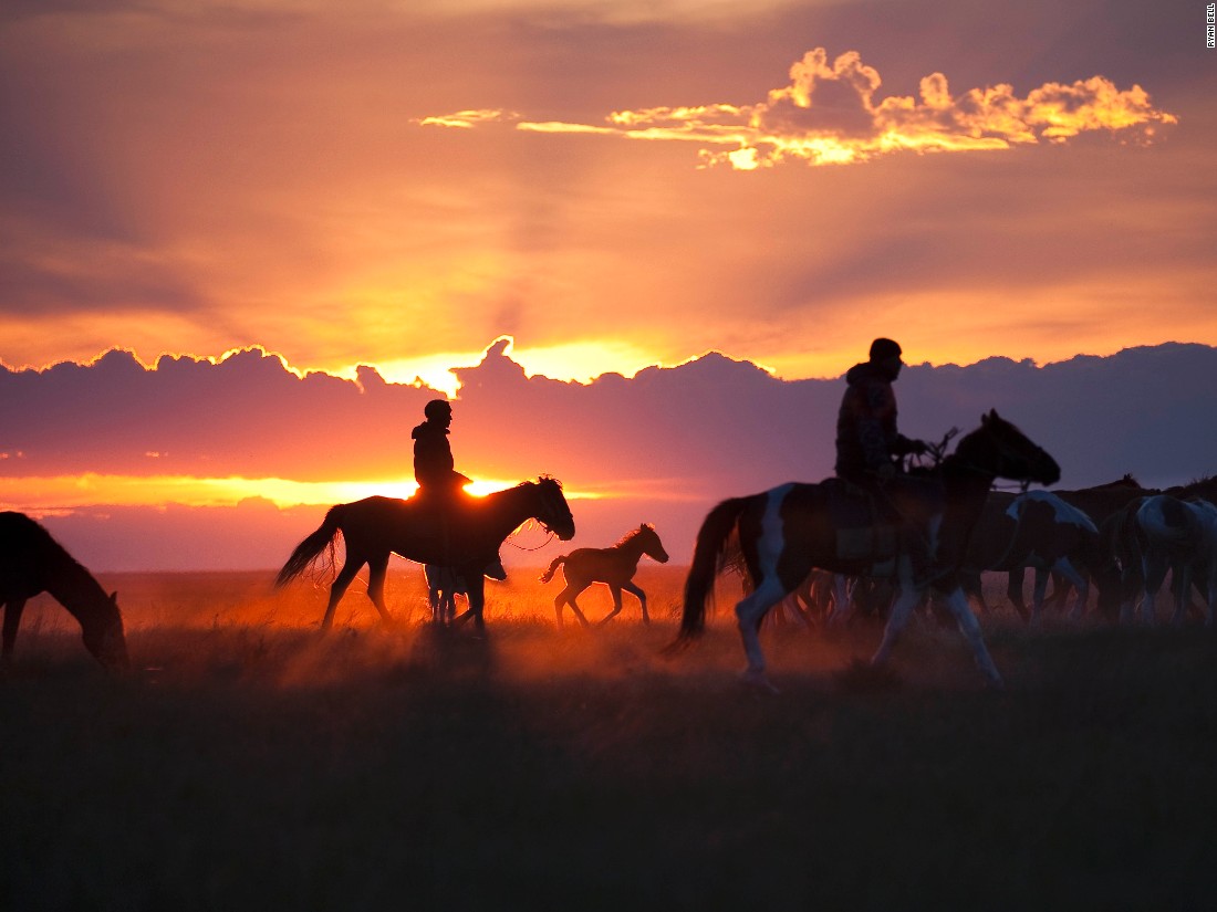 Kazakh horsemen drive their herd to a corral where they'll spend the night being guarded against horse thieves. Ryan Bell says he took this image about 100 miles from the site in Kazakhstan where archeologists have discovered the oldest-known remains of a domesticated horse. (<a href="http://travel.nationalgeographic.com/photographer-of-the-year-2016/" target="_blank">Click here to enter NatGeo photo contest</a>)