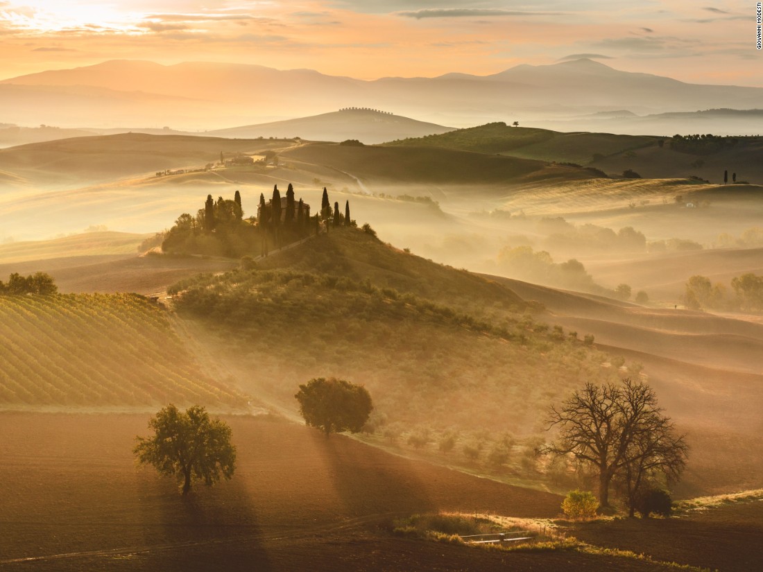 Beautiful at any time of day, the Italian region of Tuscany looks even more wonderful in this sunrise image taken by Giovanni Modesti. (<a href="http://travel.nationalgeographic.com/photographer-of-the-year-2016/" target="_blank">Click here to enter NatGeo photo contest</a>)