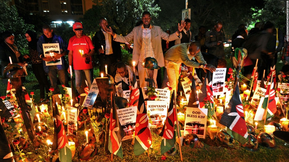 Kenyans in Nairobi pray at a candlelit vigil in honor of Kenyan soldiers on January 21, 2016. 