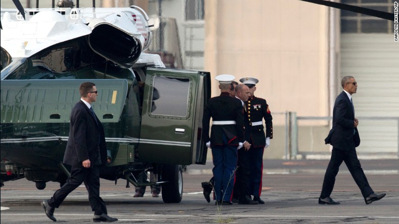 President Obama walks off Marine One at the landing zone in Hiroshima, western Japan.
