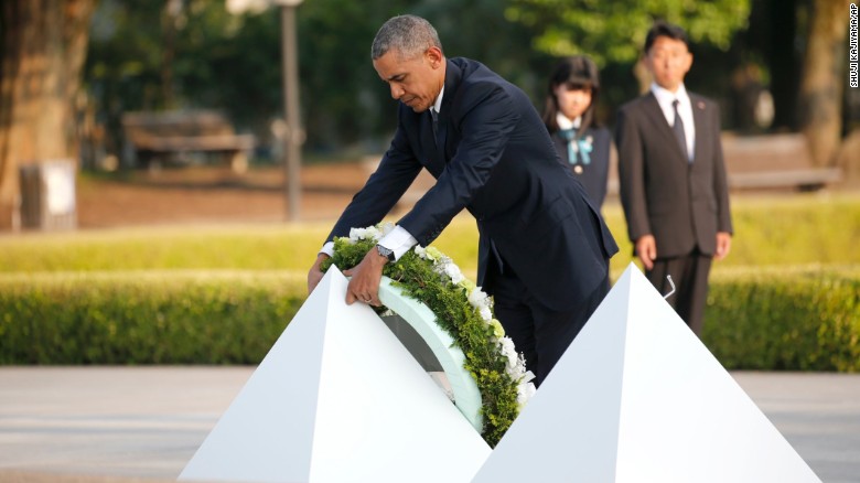 President Obama lays a wreath at Hiroshima Peace Memorial Park Friday.